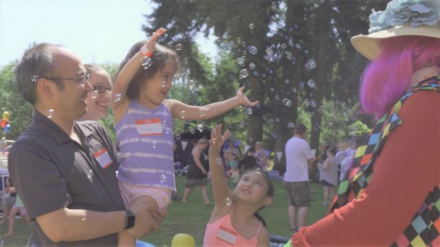 Child enjoys bubbles at NICU reunion